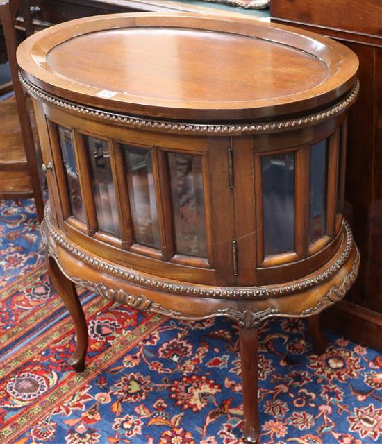 A mahogany oval tray top cabinet 2ft 4in.